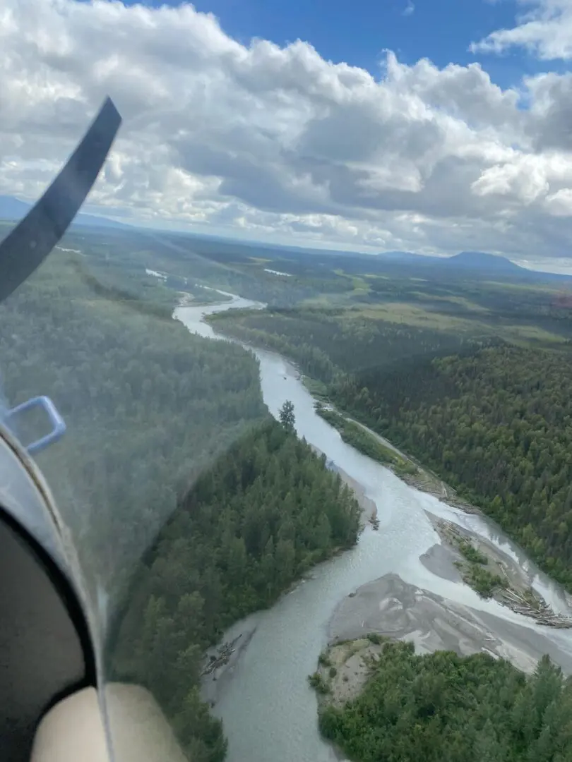 A view of a river from the wing of a plane.